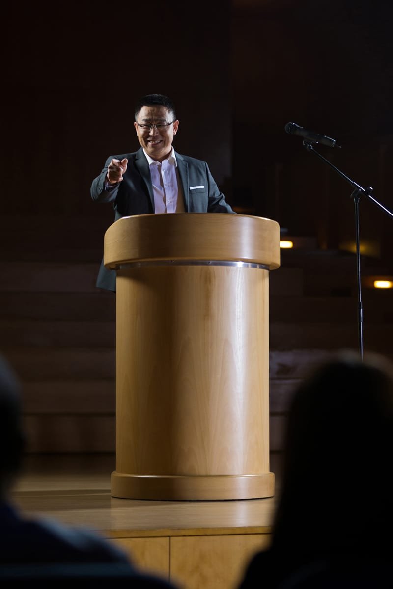 Event Photography 2 business executive pointing while giving a speech 2023 11 27 05 28 38 utc
